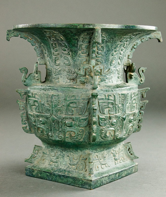 Bronze archaic–style gu vessel decorated with raised geometric patterns and marks on the interior. Price realized (excluding buyer’s premium): $110,000. Artingstall & Hind Auctioneers